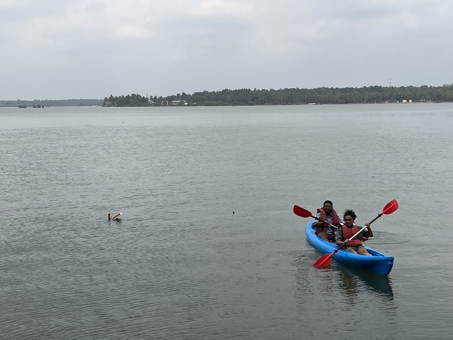 Two people sitting in a kayak